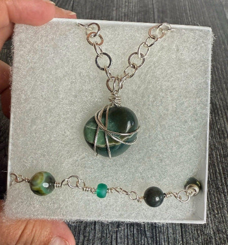 Green necklace and bracelet in a white box