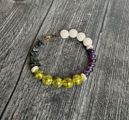 Bracelet with various colored beads on a wooden surface