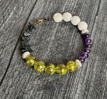 Bracelet with various colored beads on a wooden surface